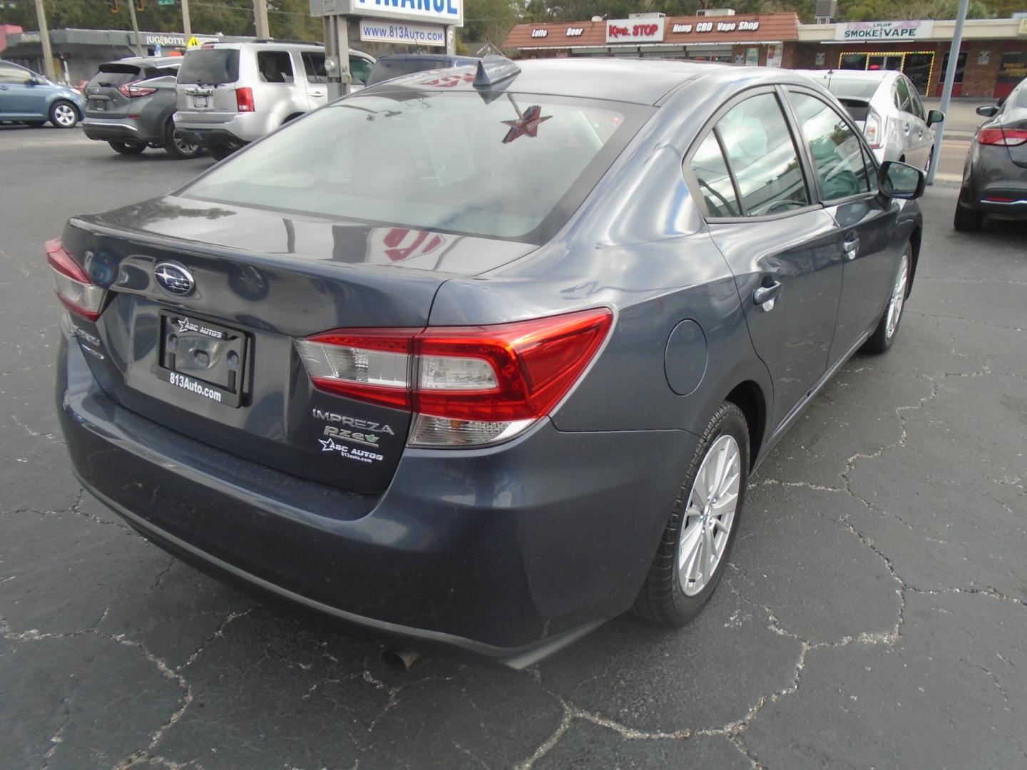 2017 Subaru Impreza 2.0i Premium CVT 4-Door (4S3GKAB65H3) with an 2.0L H4 DOHC 16V engine, CVT transmission, located at 6112 N Florida Avenue, Tampa, FL, 33604, (888) 521-5131, 27.954929, -82.459534 - Photo#3